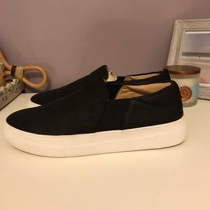 black slip-ons with a white platform sole